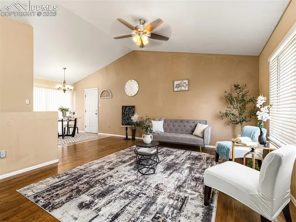 a living room with furniture and a rug