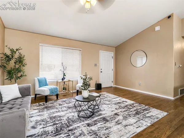 a living room with furniture rug and window