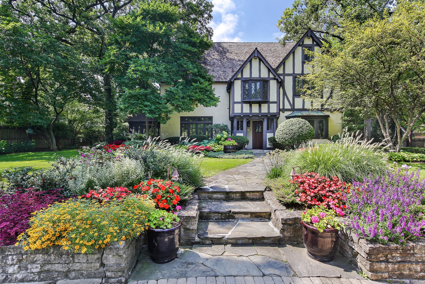 712 Taft Road Hinsdale, IL 60521 - Photo 1 of 25 a view of a house with a big yard and flower plants