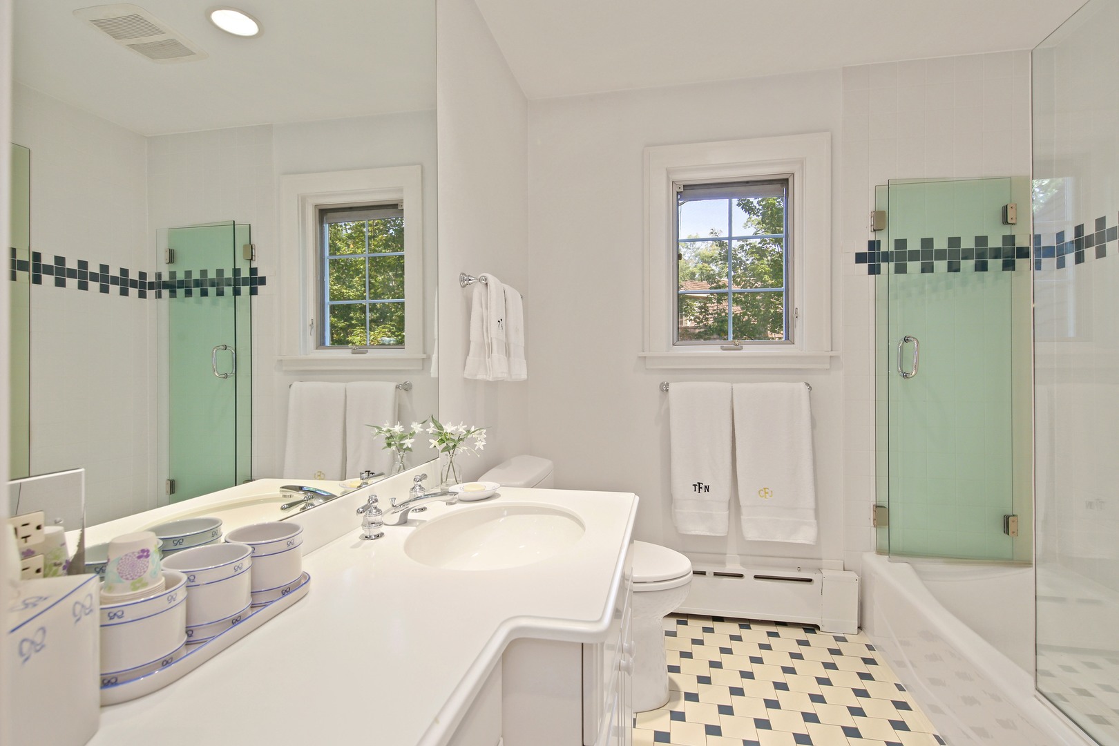 712 Taft Road Hinsdale, IL 60521 - Photo 21 of 25 a bathroom with a double vanity sink a mirror and a shower
