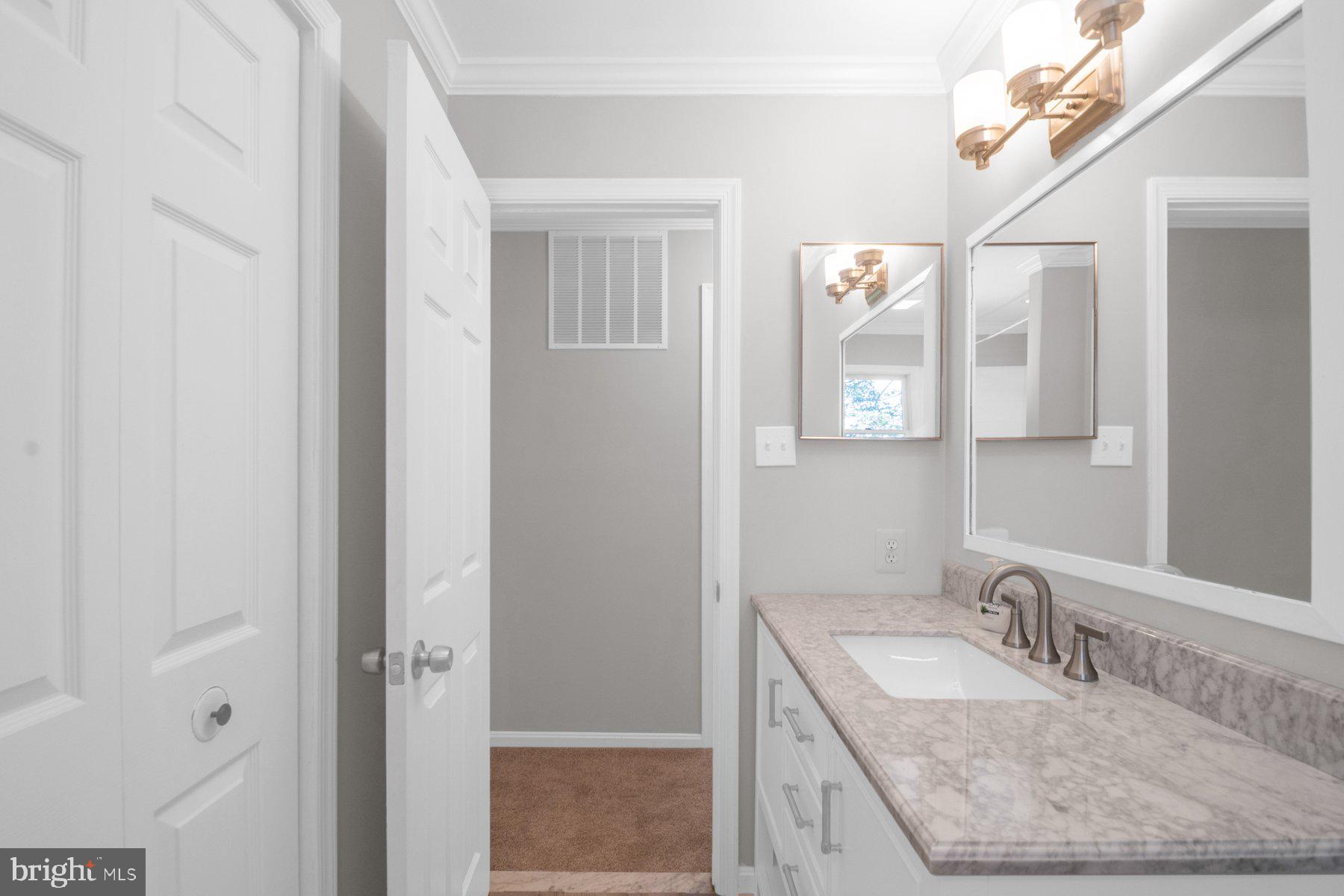2002 Deer Park Road Finksburg, MD 21048 - Photo 15 of 36 a bathroom with a granite countertop sink a mirror and shower