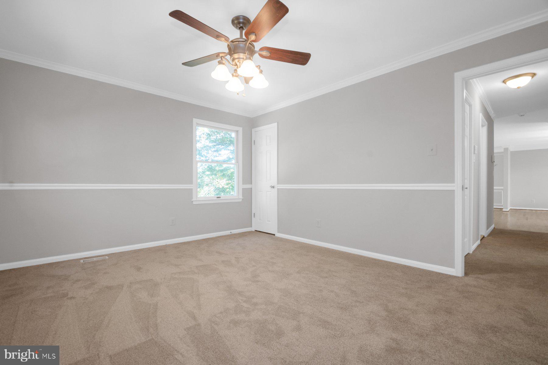 2002 Deer Park Road Finksburg, MD 21048 - Photo 19 of 36 an empty room with windows and fan