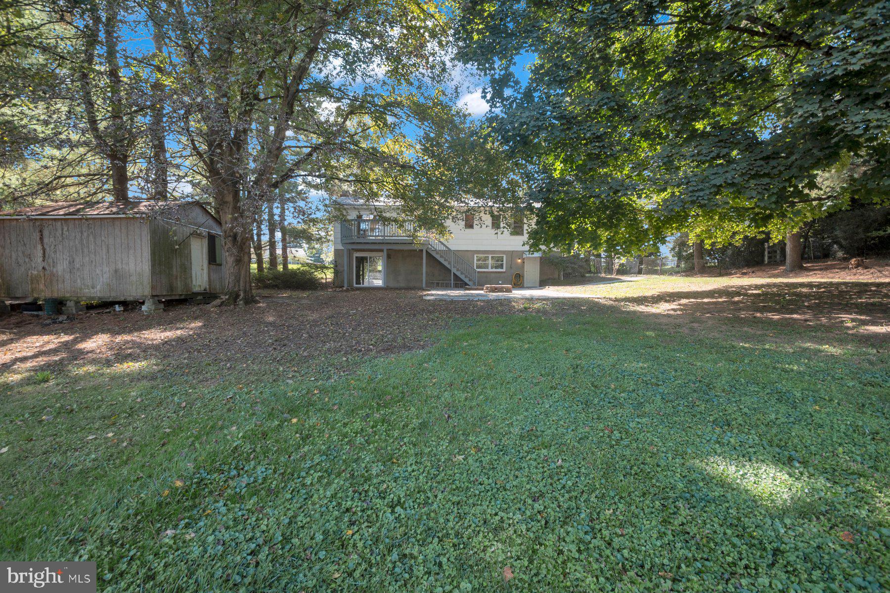 2002 Deer Park Road Finksburg, MD 21048 - Photo 4 of 36 a view of a yard with a house and large trees