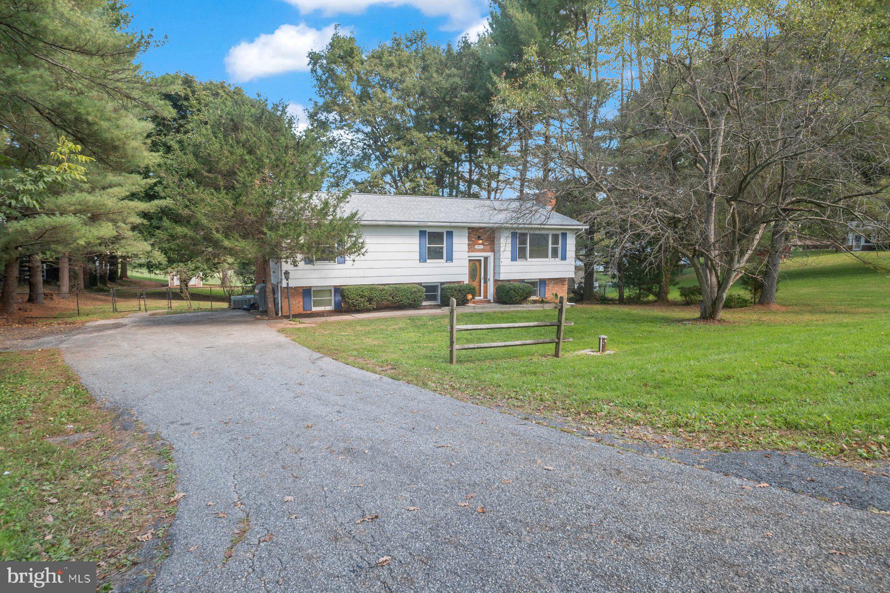 2002 Deer Park Road Finksburg, MD 21048 - Photo 5 of 36 a view of a house with a big yard and large trees