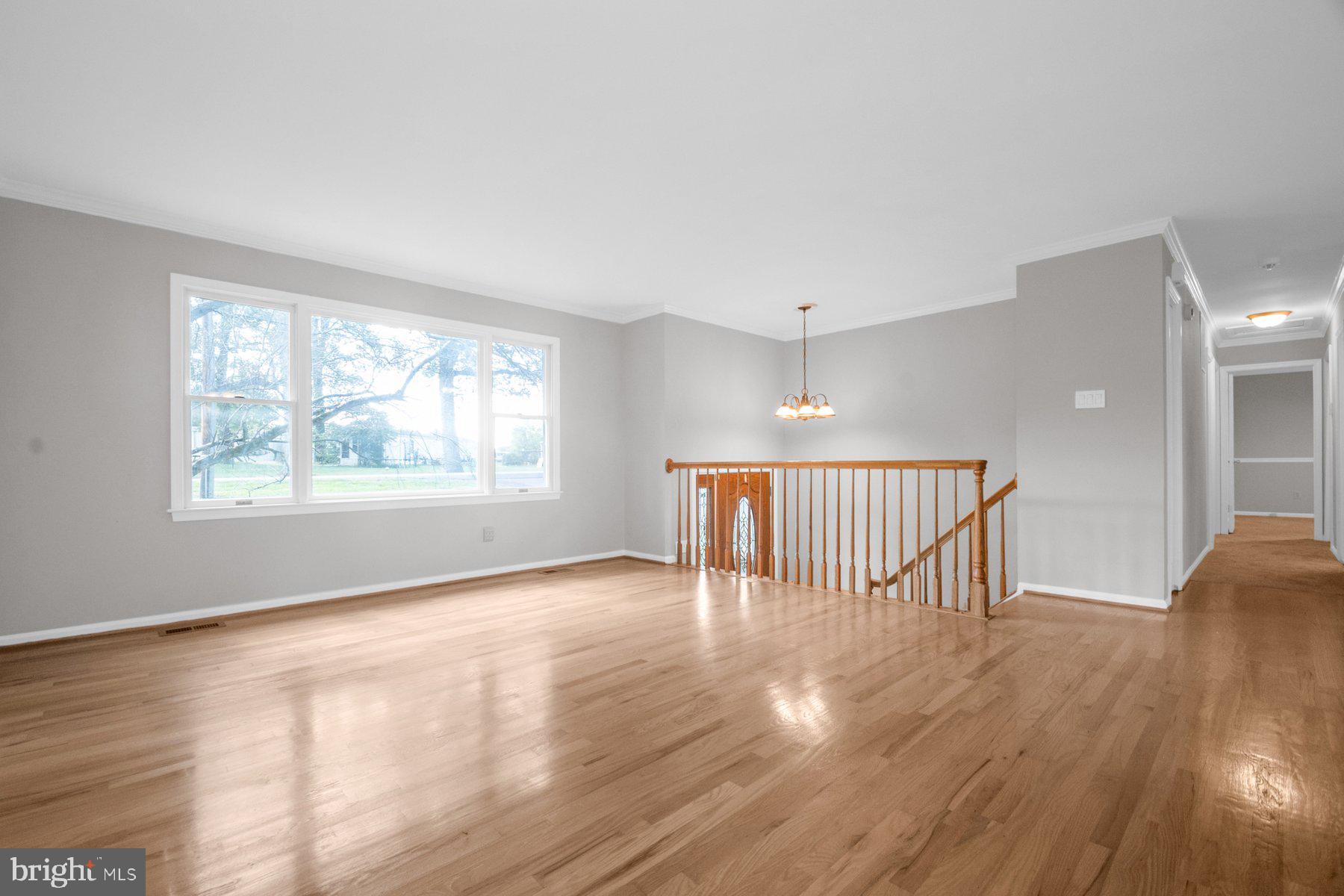 2002 Deer Park Road Finksburg, MD 21048 - Photo 8 of 36 a view of an empty room with wooden floor and a window