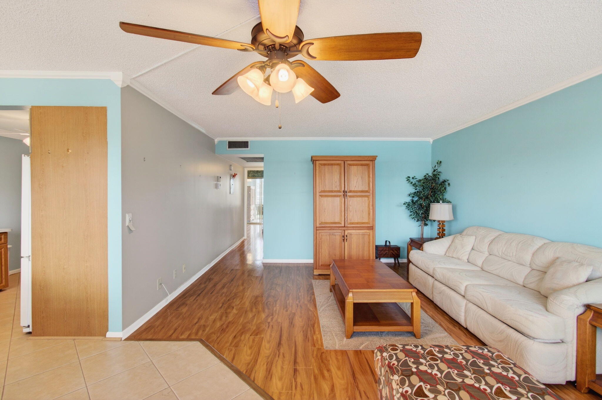 3007 Yarmouth C Boca Raton, FL 33434 - Photo 13 of 75 a living room with furniture and a chandelier