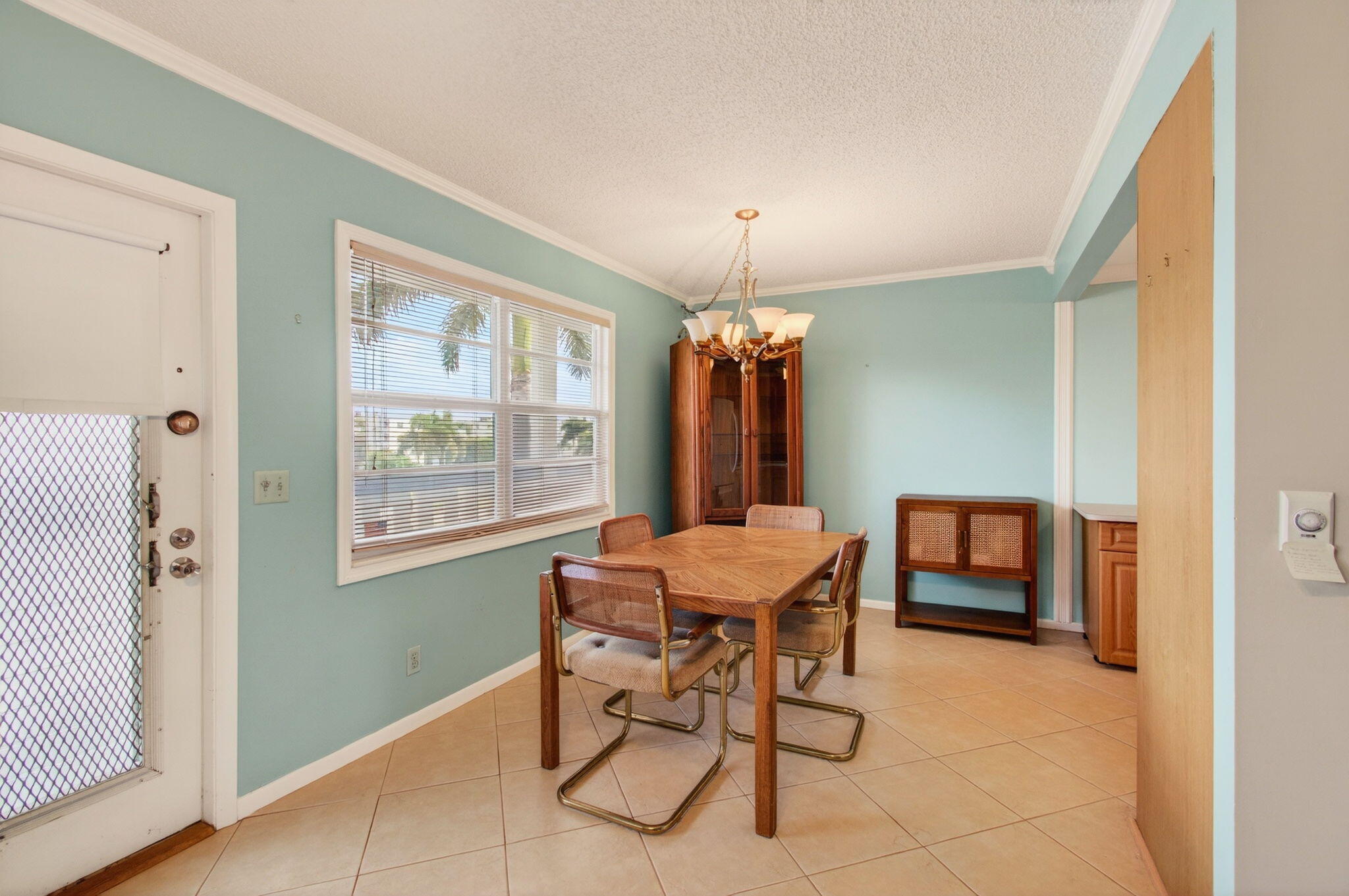 3007 Yarmouth C Boca Raton, FL 33434 - Photo 14 of 75 a view of a dining room with furniture and window