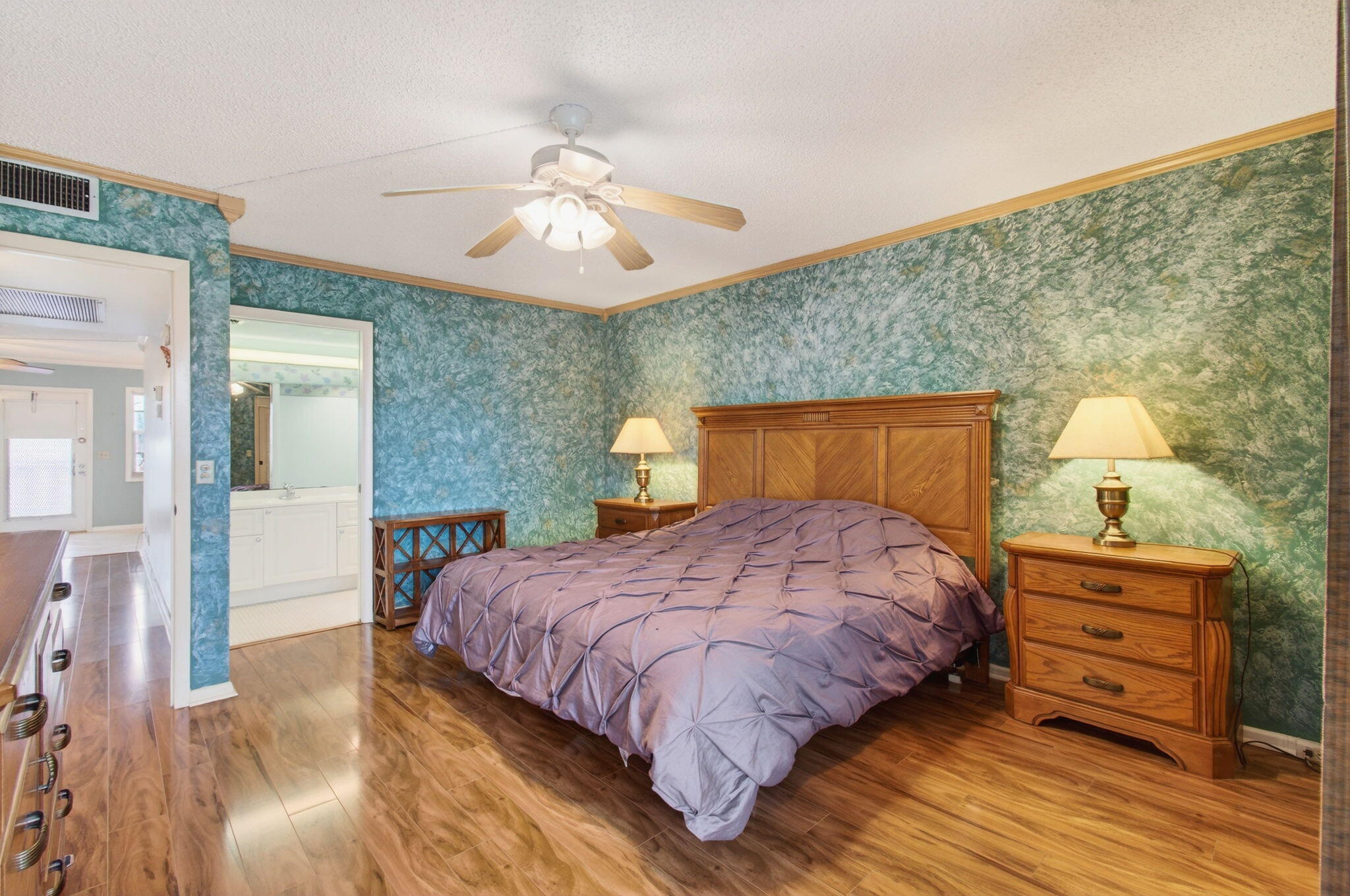 3007 Yarmouth C Boca Raton, FL 33434 - Photo 23 of 75 a bedroom with a bed and wooden floor