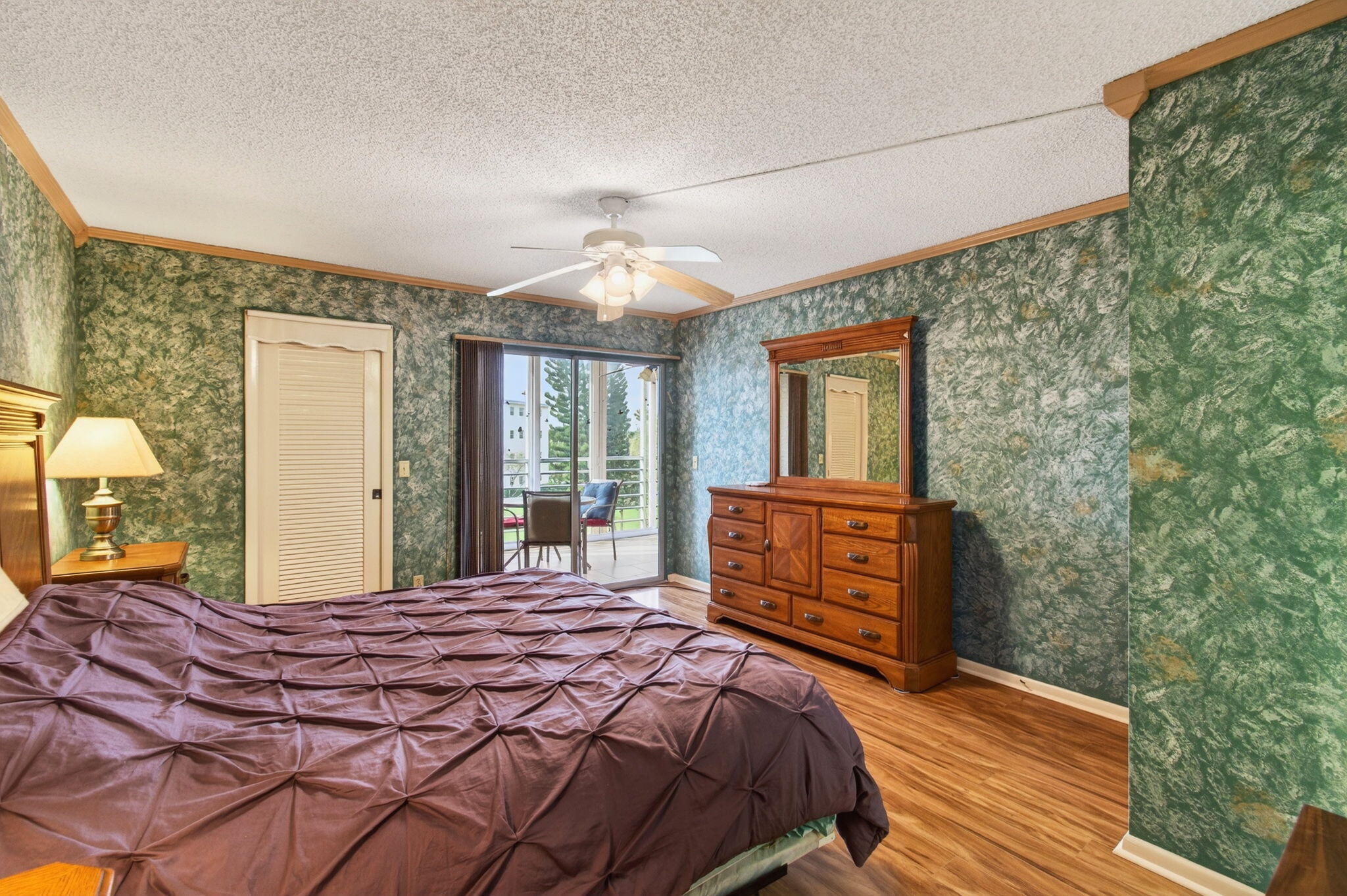 3007 Yarmouth C Boca Raton, FL 33434 - Photo 26 of 75 a bedroom with a bed and a dresser next to a window