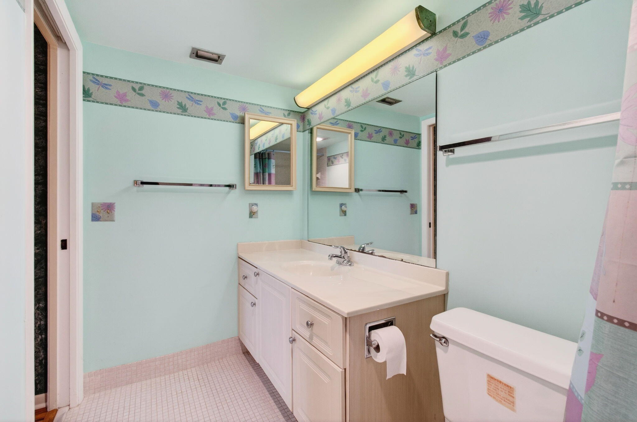 3007 Yarmouth C Boca Raton, FL 33434 - Photo 29 of 75 a utility room with a sink a toilet and a mirror
