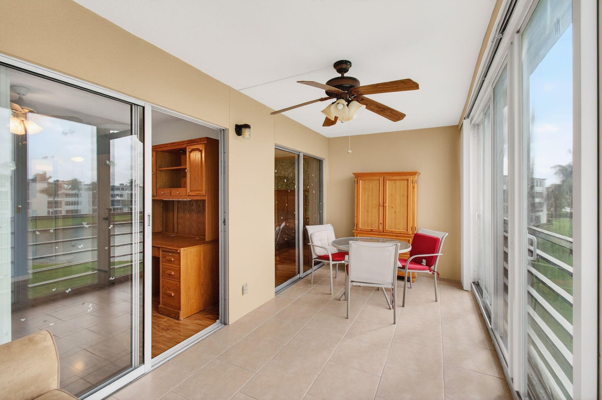3007 Yarmouth C Boca Raton, FL 33434 - Photo 39 of 75 a living room with furniture and a floor to ceiling window