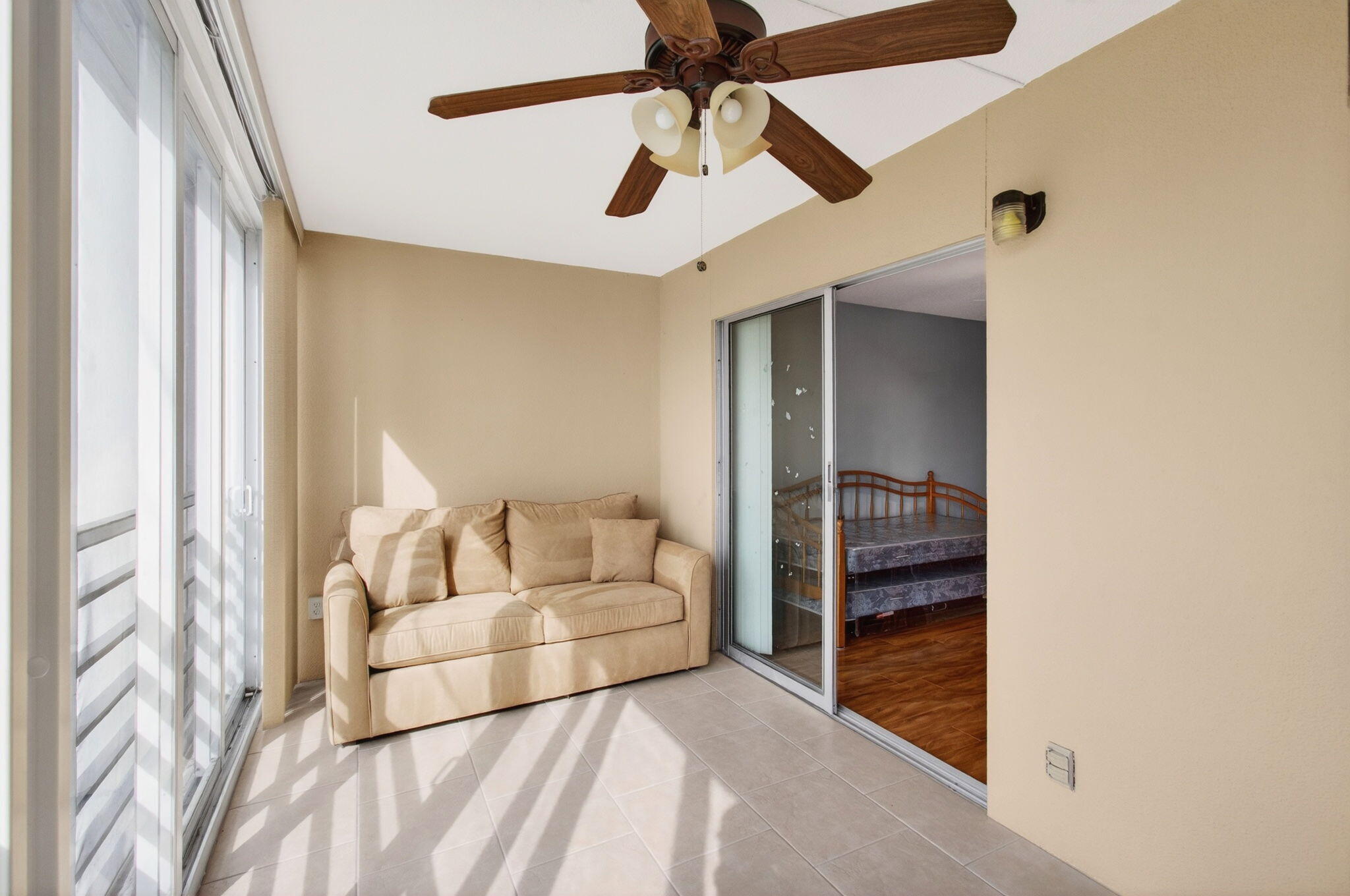3007 Yarmouth C Boca Raton, FL 33434 - Photo 42 of 75 a living room with furniture and a ceiling fan