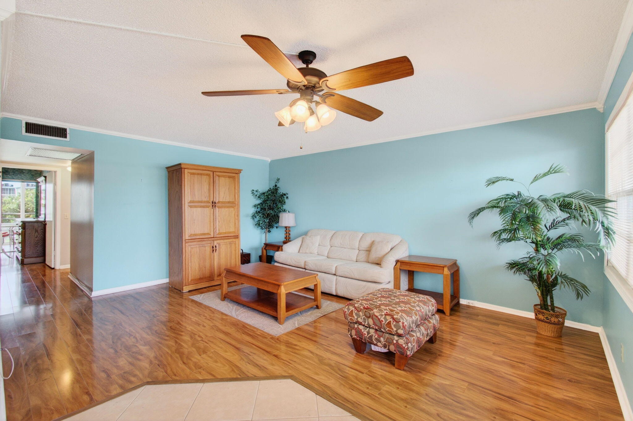 3007 Yarmouth C Boca Raton, FL 33434 - Photo 9 of 75 a living room with furniture and a wooden floor