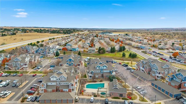 an aerial view of residential building and lake