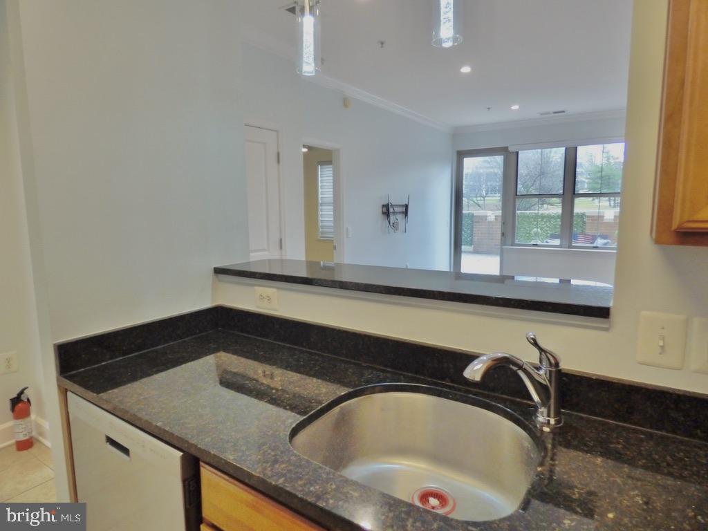 11800 Sunset Hills Road, Unit 118 Reston, VA 20190 - Photo 9 of 52 Modern kitchen with sleek finishes.
