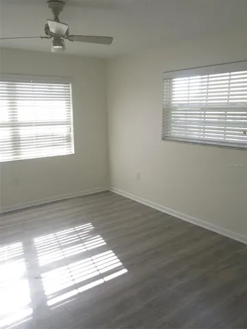a view of an empty room and a window