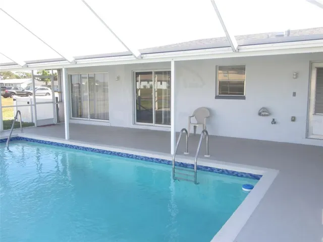 a view of a room with wooden floor and chair