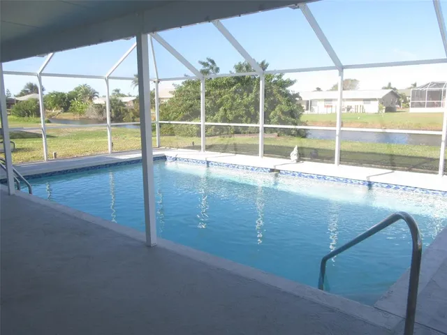 a view of a lake with houses in the back