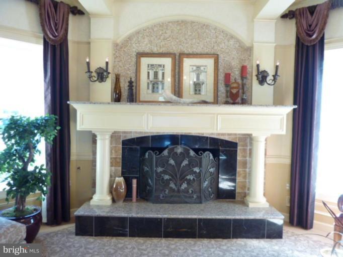 a view of living room with furniture and a fireplace