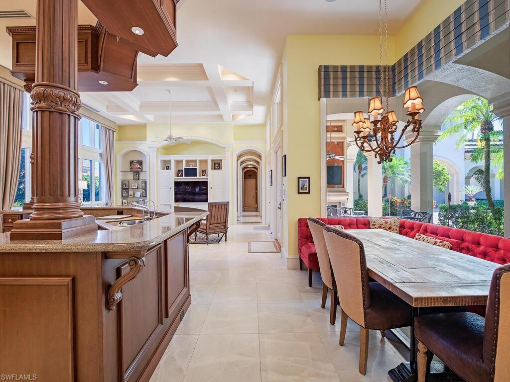 6955 Verde Way Naples, FL 34108 - Photo 14 of 42 a view of a dining room with furniture