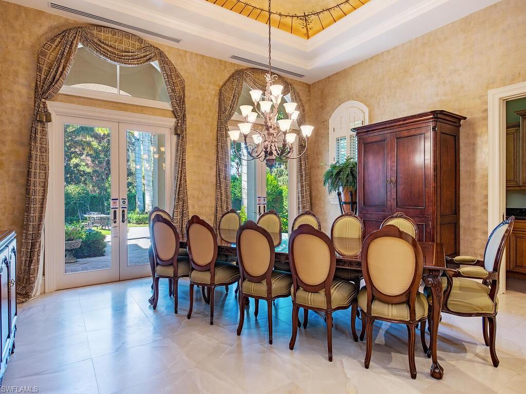 6955 Verde Way Naples, FL 34108 - Photo 17 of 42 a view of a dining room with furniture window and outside view