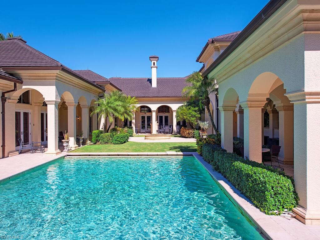 6955 Verde Way Naples, FL 34108 - Photo 36 of 42 a view of a house with swimming pool
