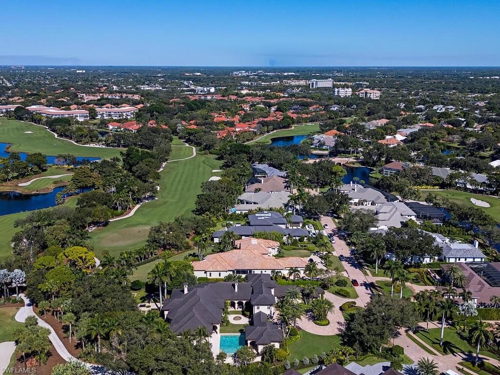 6955 Verde Way Naples, FL 34108 - Photo 7 of 42 an aerial view of a city with lots of residential buildings