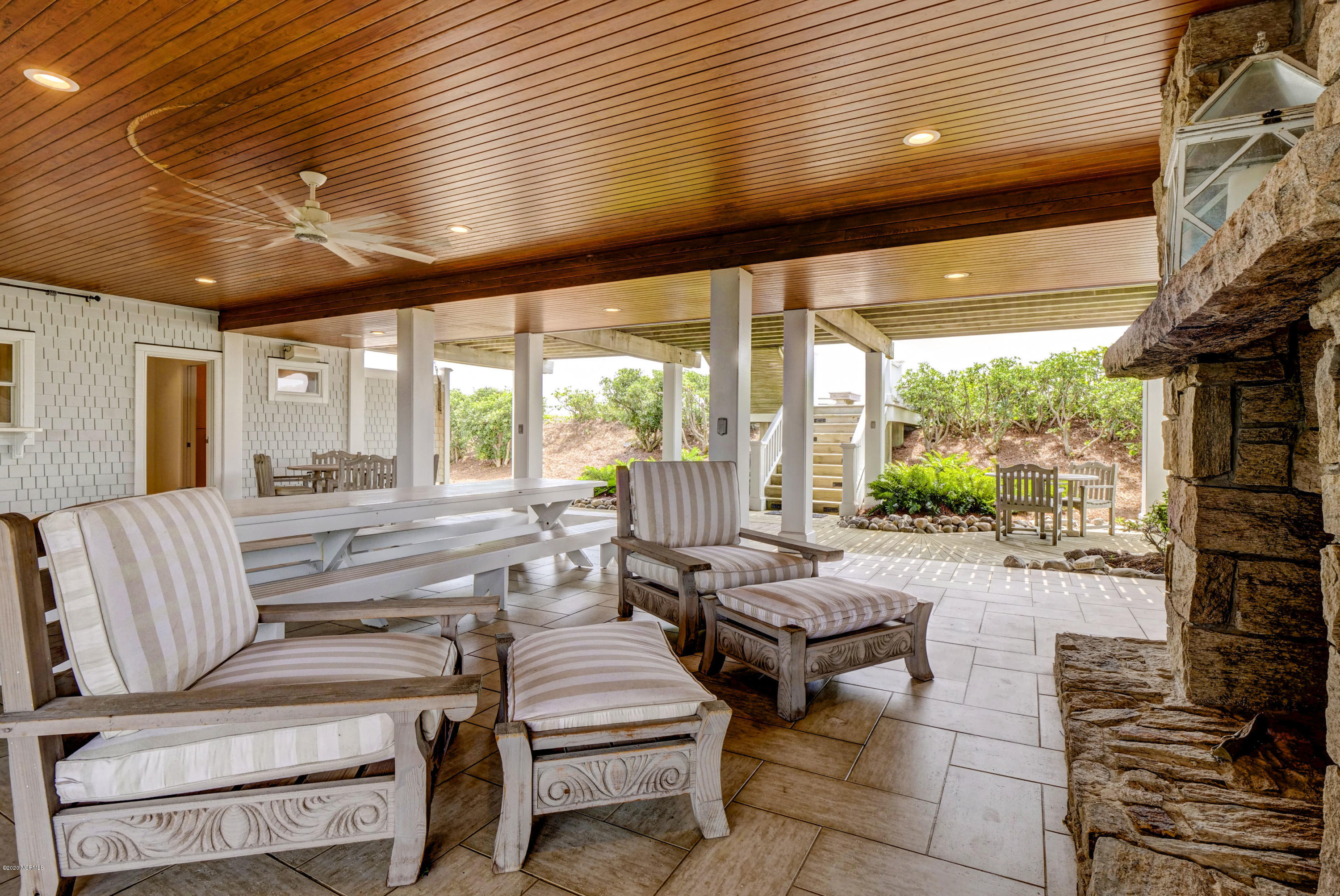 142 Beach Road South Wilmington, NC 28411 - Photo 60 of 81 Seating area in front of oversized log burning fireplace. Tile flooring.