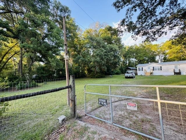 11817 Southwest 58th Street Webster, FL 33597 - Photo 44 of 46 a view of a house with a yard