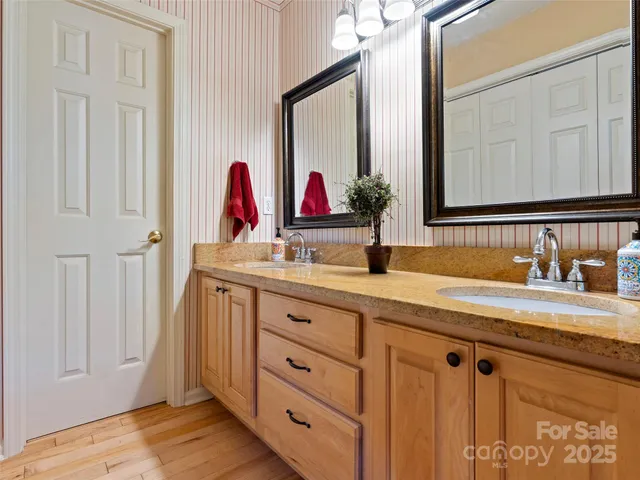 a bathroom with a sink vanity and mirror