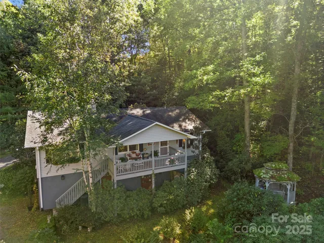 a view of house with outdoor space and garden