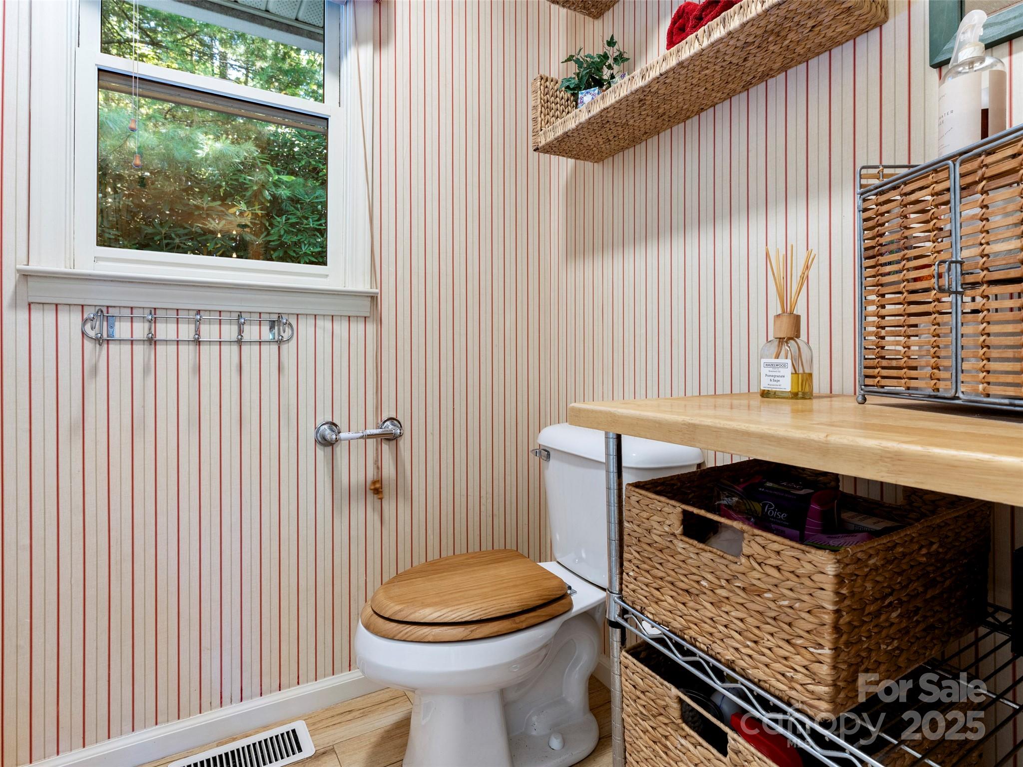 296 Ivy Ridge Circle Sylva, NC 28779 - Photo 23 of 42 a bathroom with a toilet a sink and a window