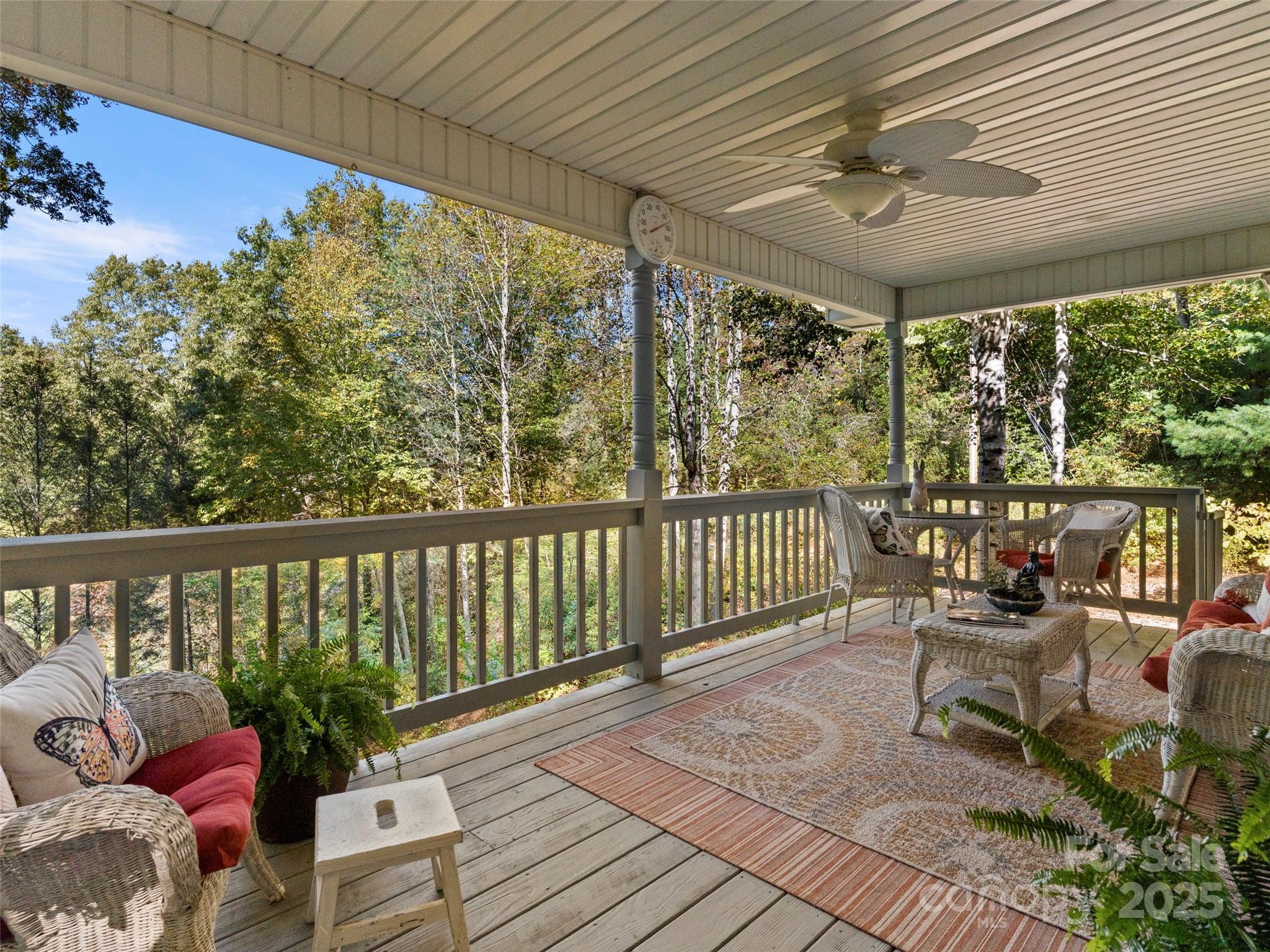 296 Ivy Ridge Circle Sylva, NC 28779 - Photo 24 of 42 a balcony with furniture and wooden floor