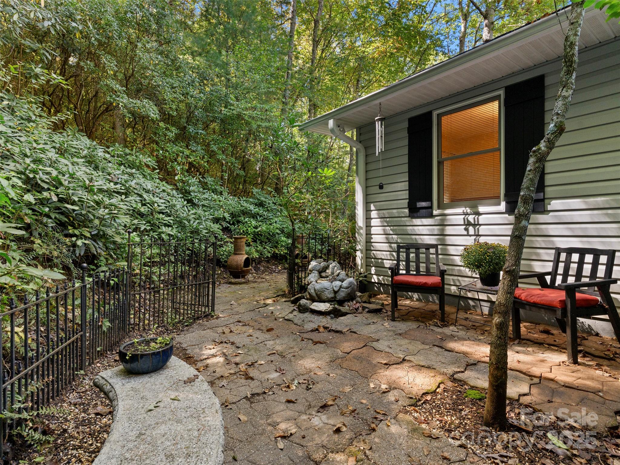 296 Ivy Ridge Circle Sylva, NC 28779 - Photo 28 of 42 a view of a chairs and table in the back yard