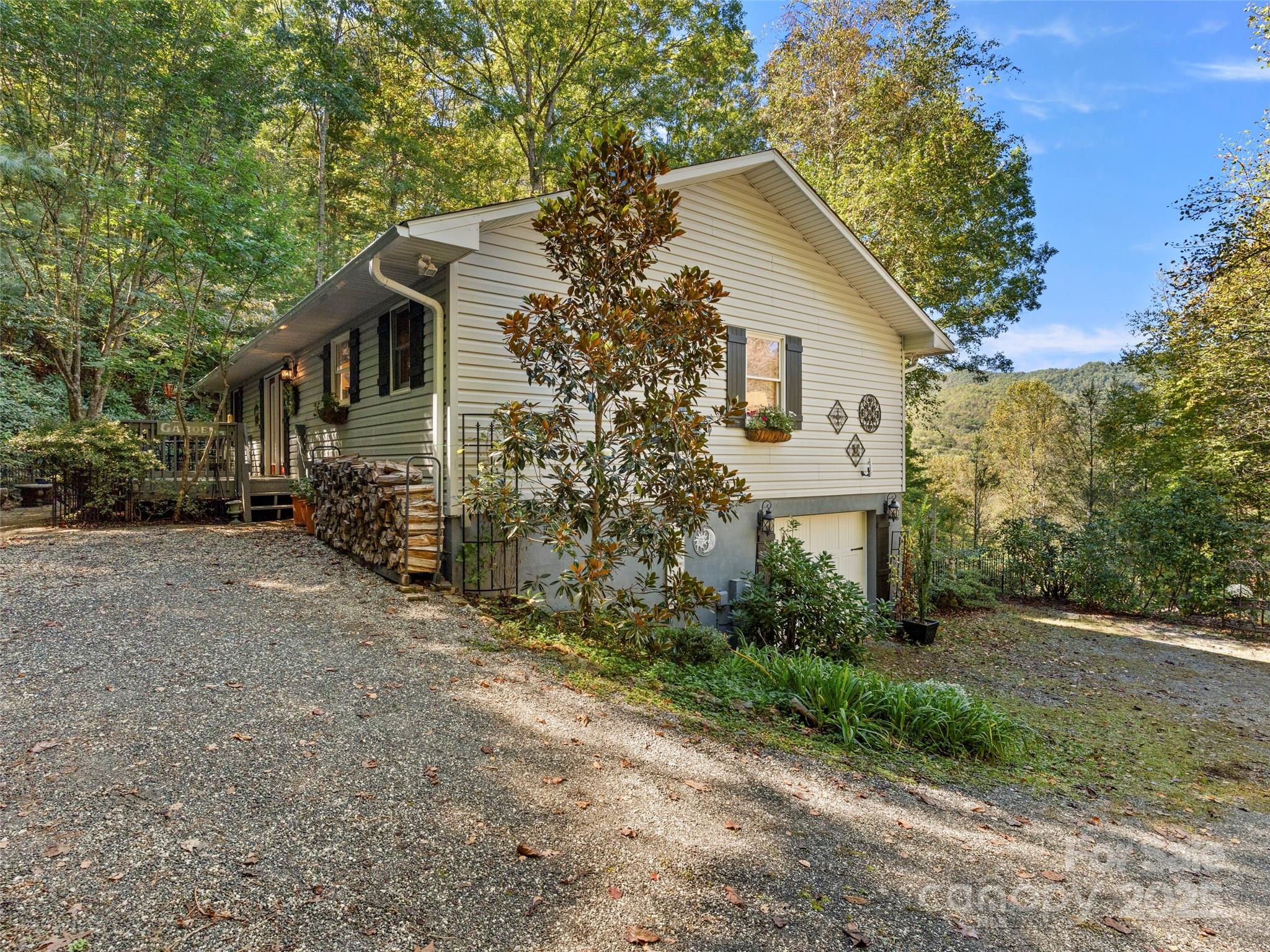 296 Ivy Ridge Circle Sylva, NC 28779 - Photo 34 of 42 a front view of a house with garden