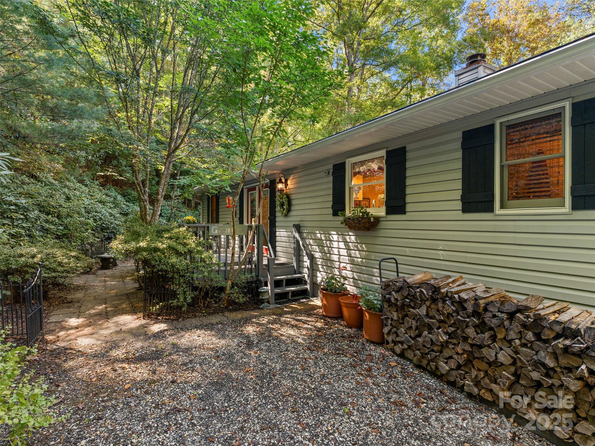 296 Ivy Ridge Circle Sylva, NC 28779 - Photo 35 of 42 a backyard of a house with lots of green space