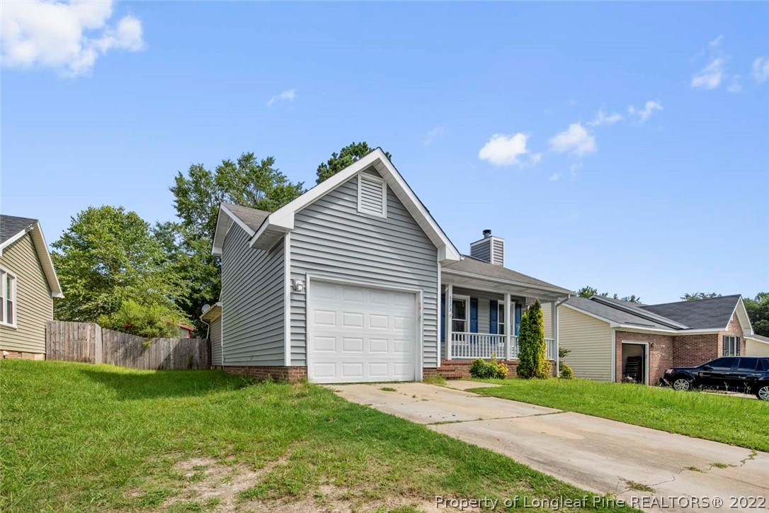 6573 Applewhite Road Fayetteville, NC 28304 - Photo 1 of 35 front view of a house with a yard