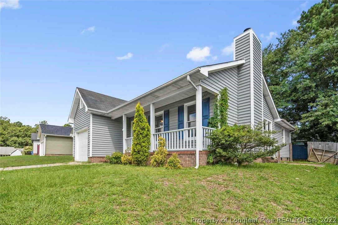6573 Applewhite Road Fayetteville, NC 28304 - Photo 2 of 35 a front view of house with a garden
