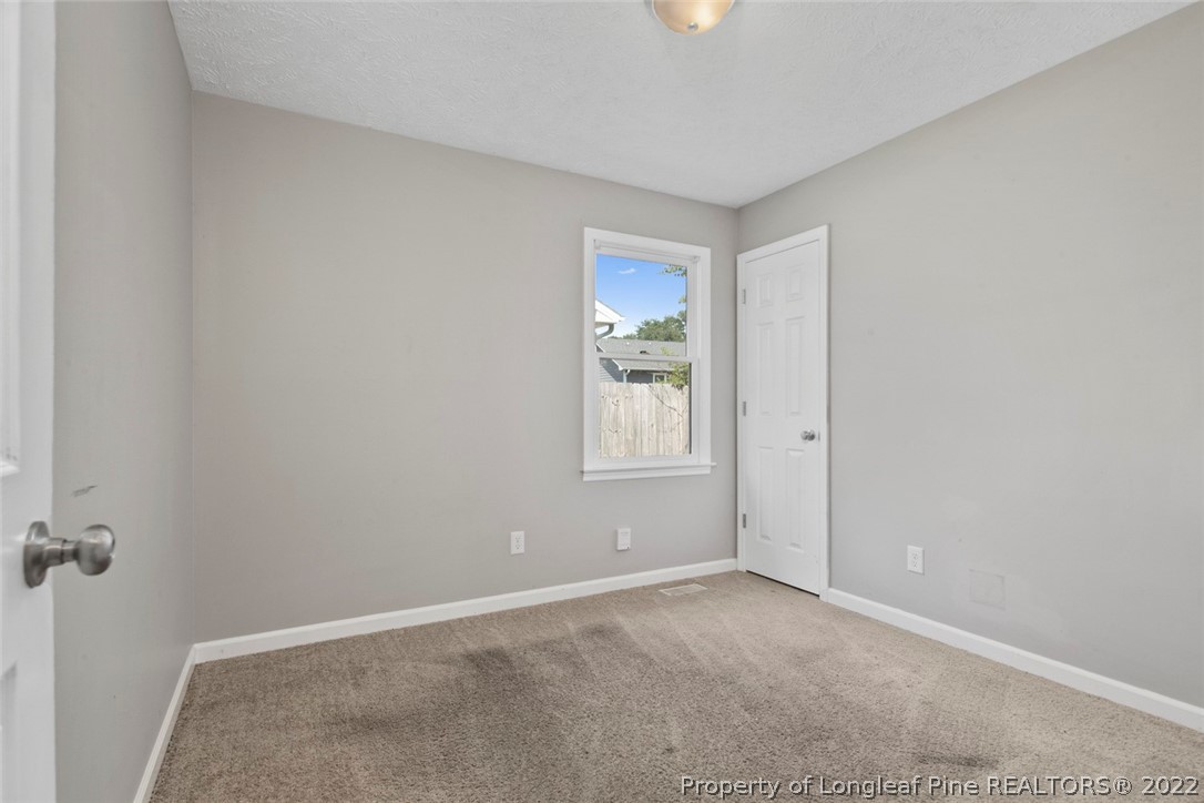 6573 Applewhite Road Fayetteville, NC 28304 - Photo 22 of 35 a view of an empty room with a window