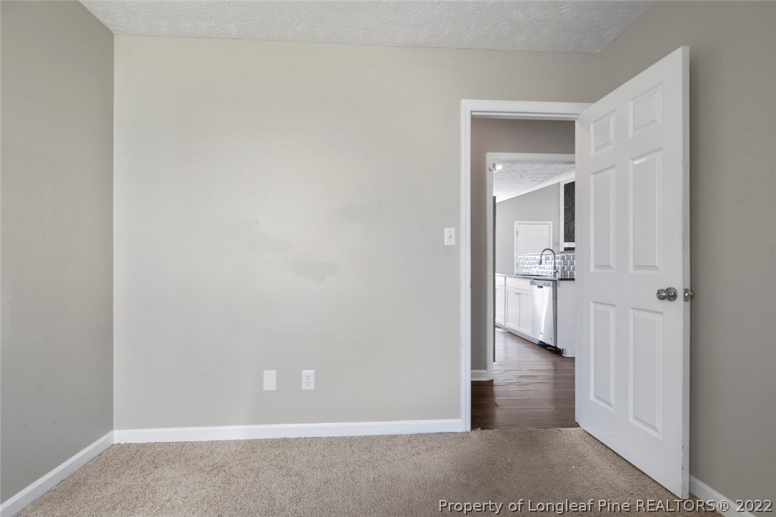 6573 Applewhite Road Fayetteville, NC 28304 - Photo 23 of 35 a view of a room with a wardrobe space