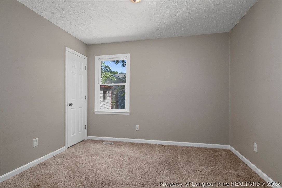 6573 Applewhite Road Fayetteville, NC 28304 - Photo 24 of 35 a view of an empty room with a window