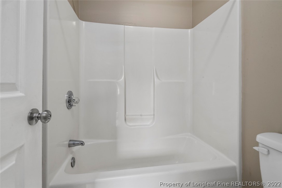 6573 Applewhite Road Fayetteville, NC 28304 - Photo 29 of 35 a close up of a bathtub curtain