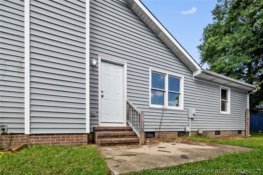 6573 Applewhite Road Fayetteville, NC 28304 - Photo 32 of 35 a view of a house with a yard and stairs