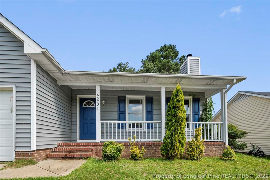 6573 Applewhite Road Fayetteville, NC 28304 - Photo 5 of 35 front view of a house with a yard