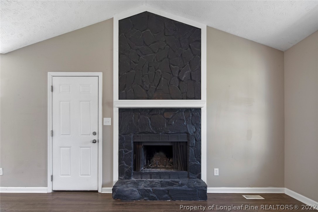6573 Applewhite Road Fayetteville, NC 28304 - Photo 10 of 35 a living room with a fireplace