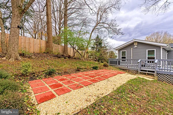 a backyard of a house with barbeque oven