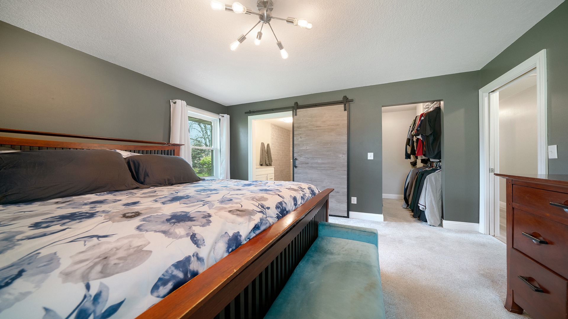 401 Deer Chase Dixon, IL 61021 - Photo 17 of 39 a bedroom with a large bed and a chandelier