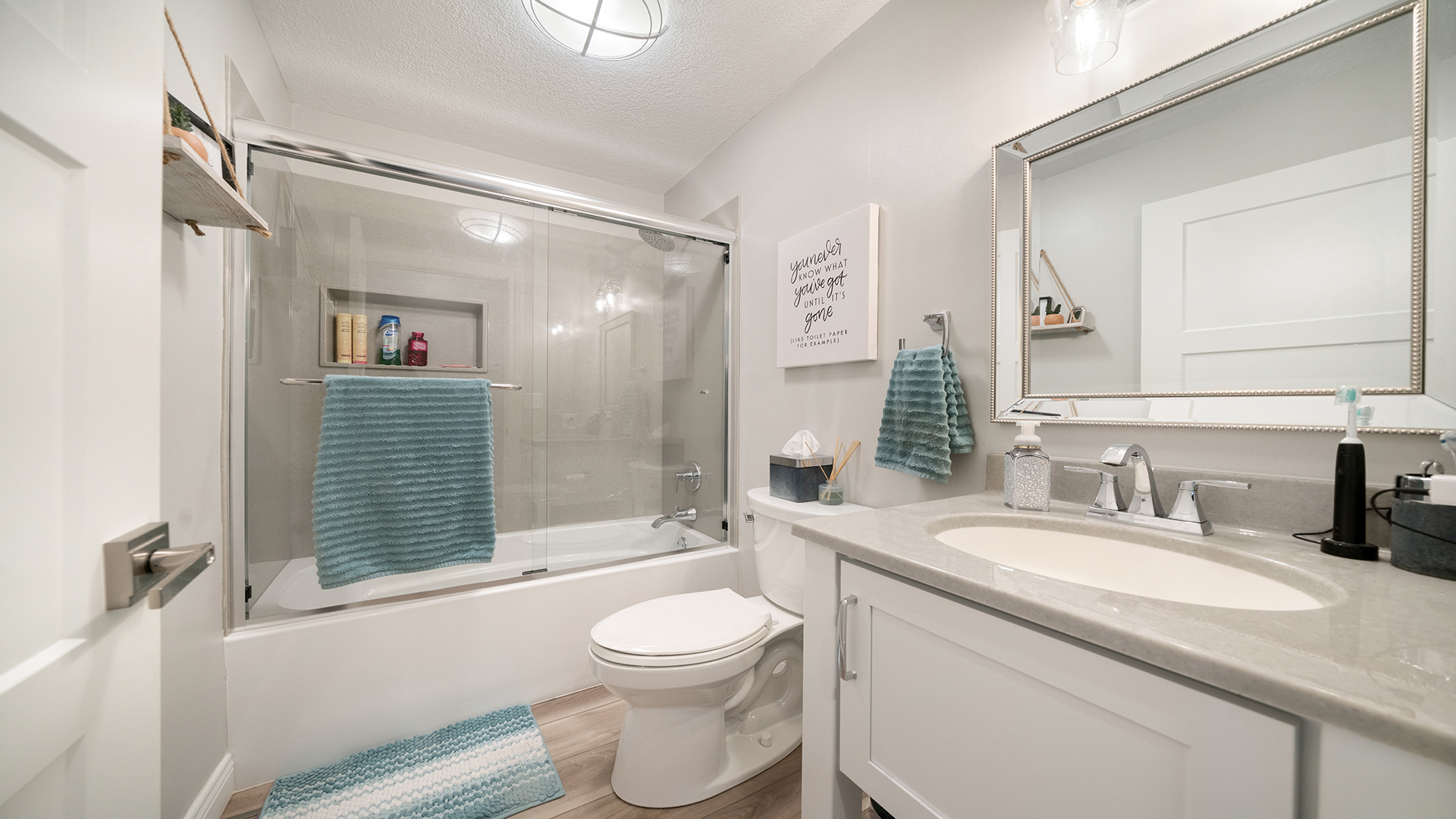 401 Deer Chase Dixon, IL 61021 - Photo 25 of 39 a bathroom with a granite countertop sink toilet a mirror a bathtub and shower