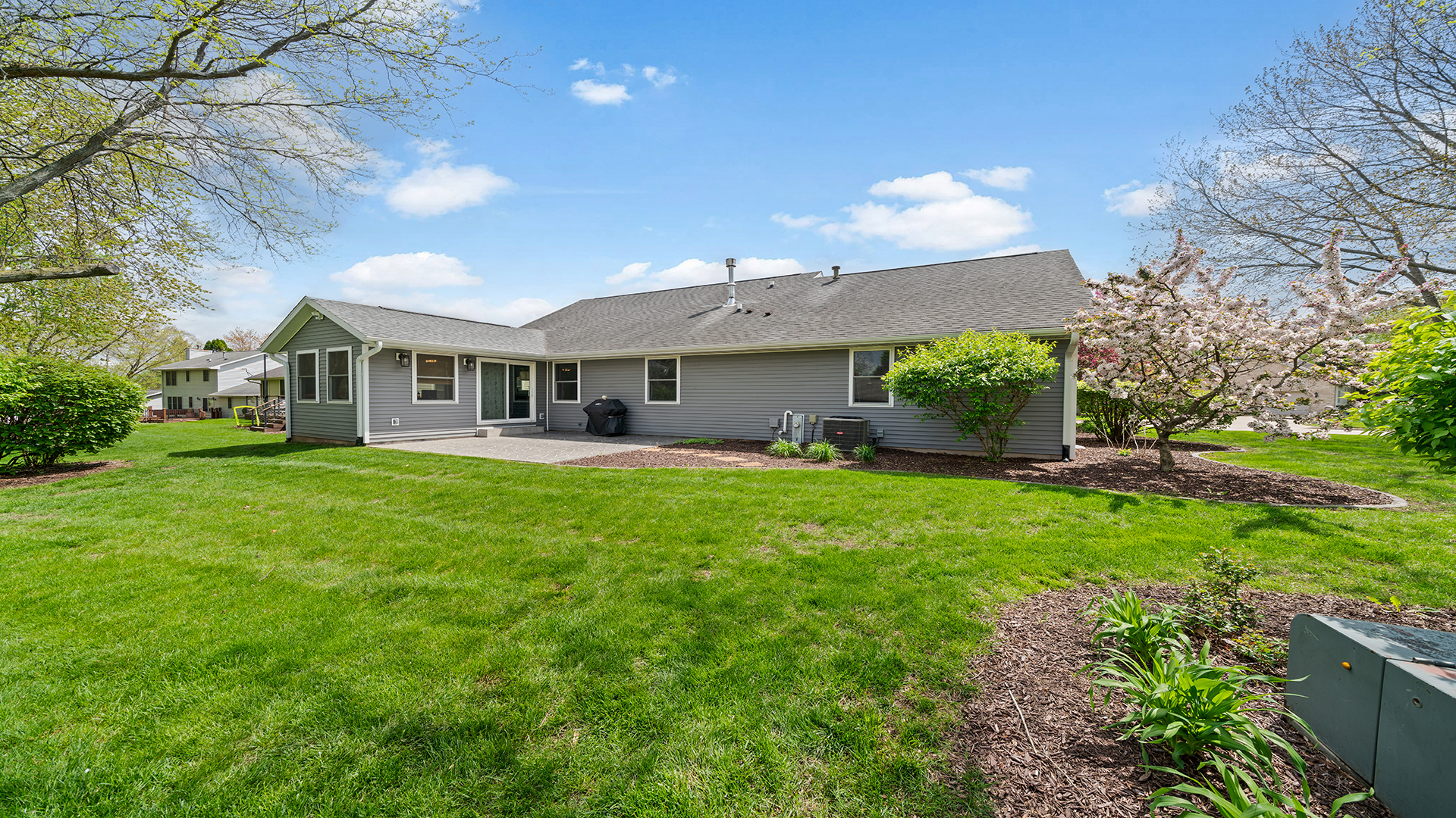 401 Deer Chase Dixon, IL 61021 - Photo 34 of 39 a front view of a house with a yard and potted plants
