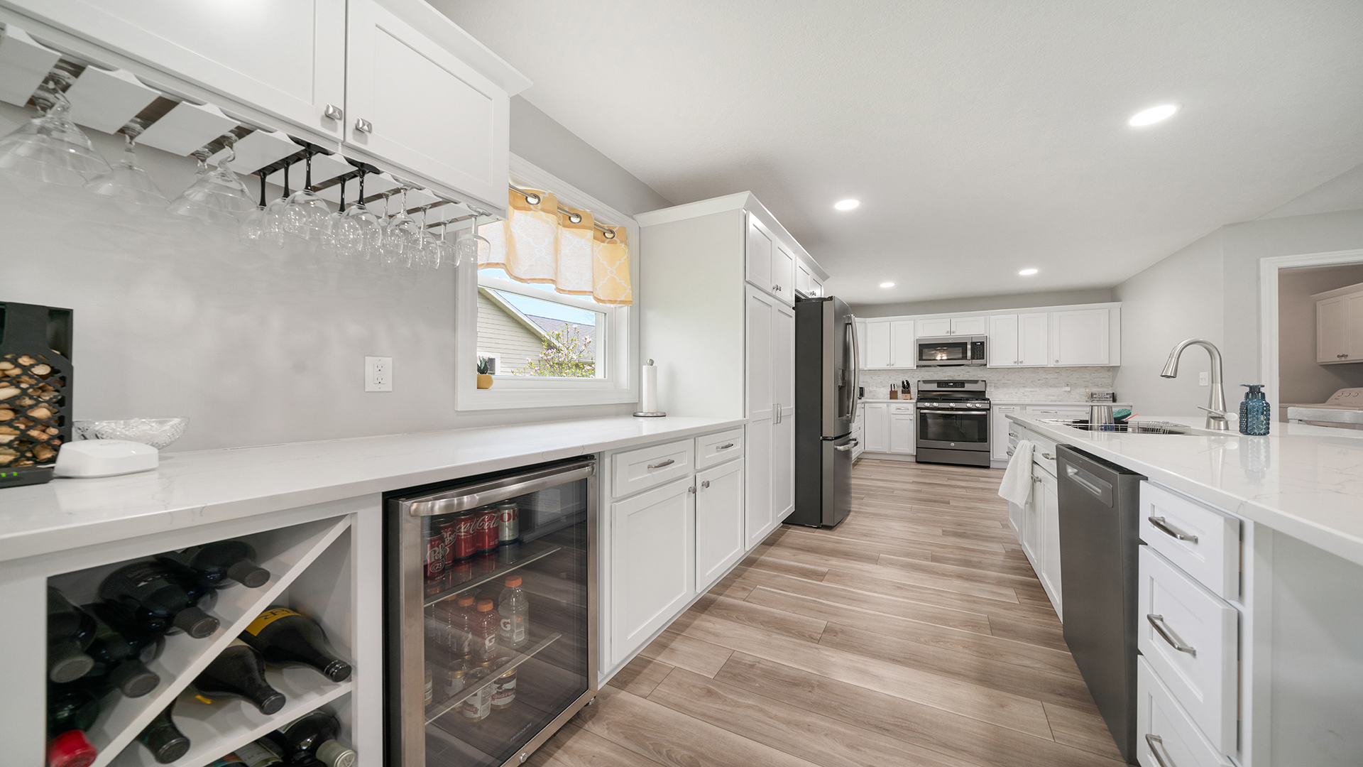 401 Deer Chase Dixon, IL 61021 - Photo 7 of 39 a large kitchen with stainless steel appliances lots of counter space and wooden floor